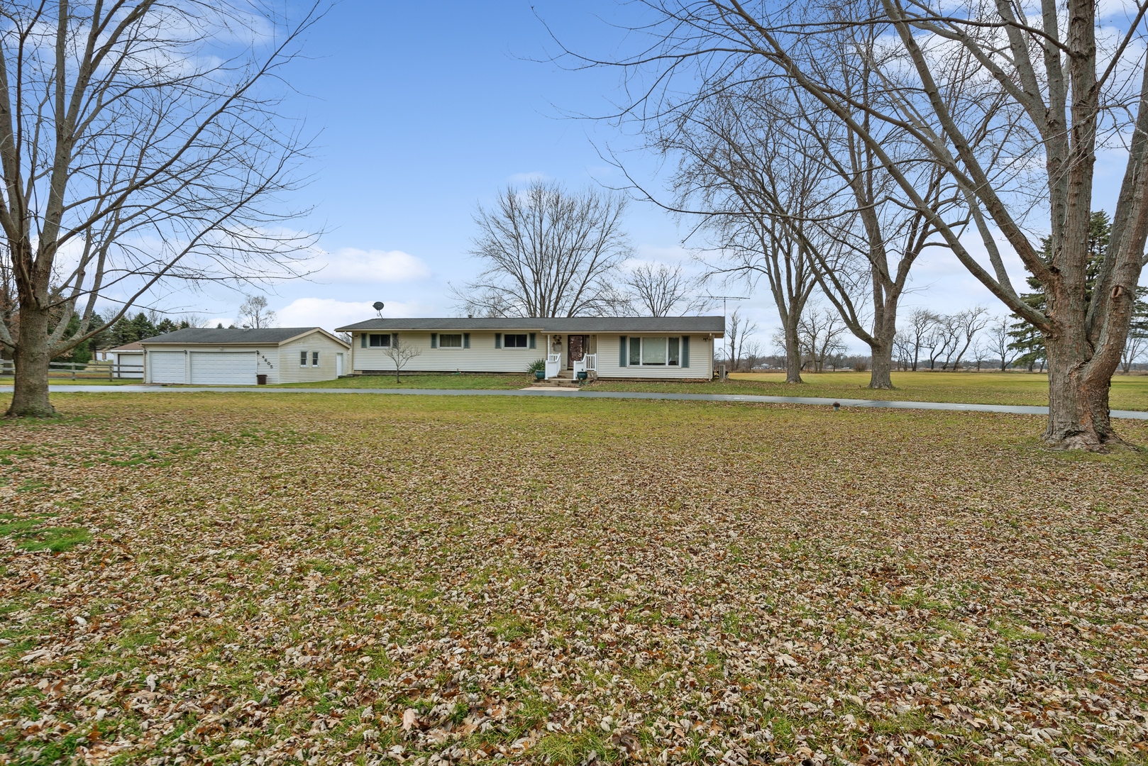 4605 South Ridgeway Road Ringwood, IL 60072 - Photo 21 of 25 a view of a large building with trees in the background