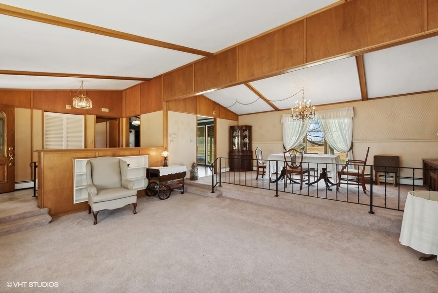 4605 South Ridgeway Road Ringwood, IL 60072 - Photo 4 of 25 a living room with furniture a fireplace and large windows