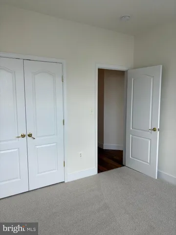 a view of an empty room and entryway