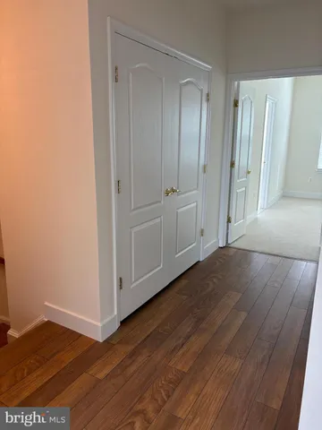 a view of wooden floor in an empty room