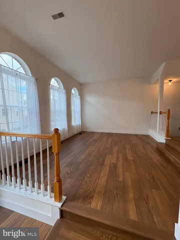 a view of wooden floor and staircase