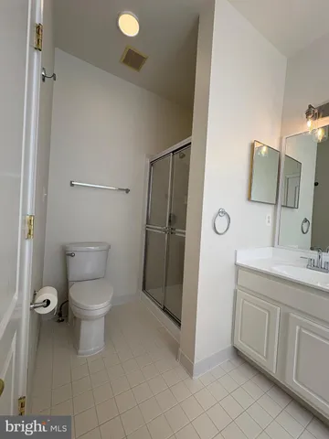 a bathroom with a toilet sink and shower