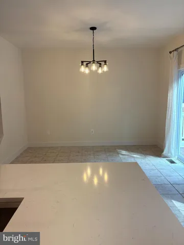 a view of a room with an empty space