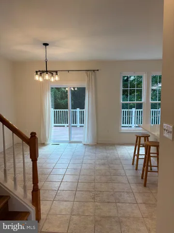 a view of a room with furniture window and wooden floor