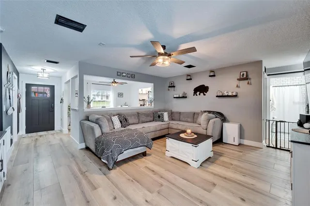 a living room with furniture and a large window