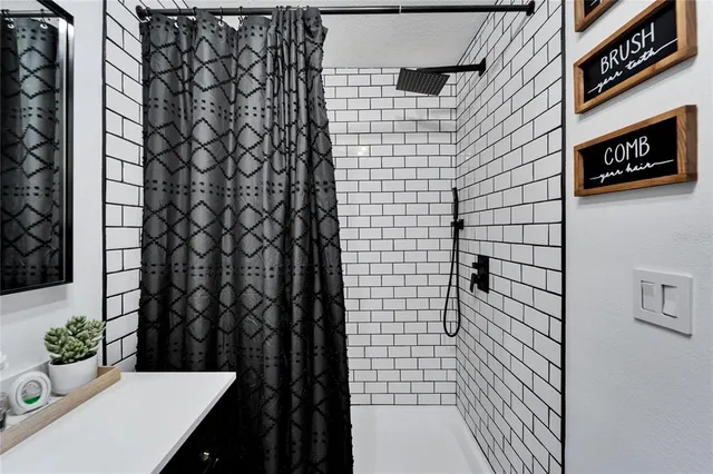 a bedroom with a bed and a desk