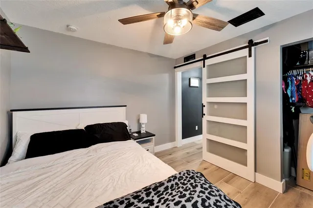 a bathroom with a sink a toilet and shower curtain