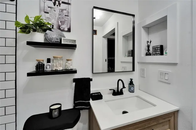 a bedroom with a bed and a desk