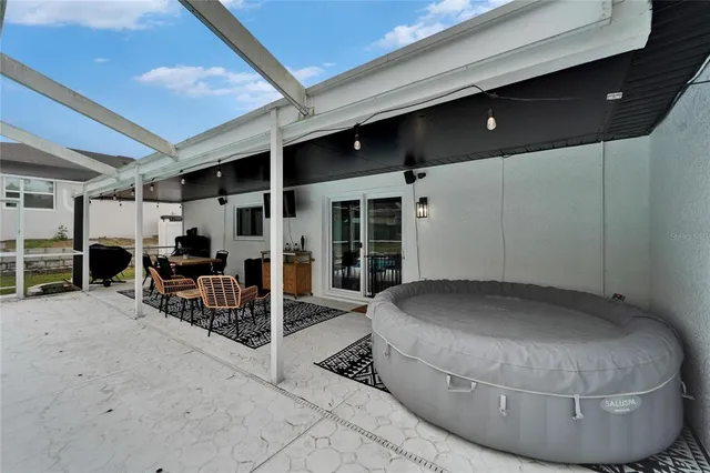 a view of a swimming pool with a patio