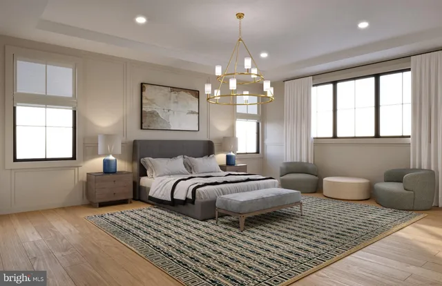 a spacious bedroom with a bed and a couch