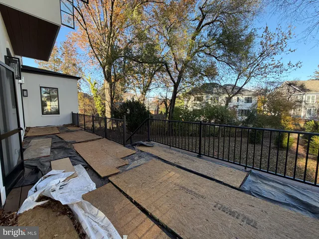 a view of a terrace with wooden fence