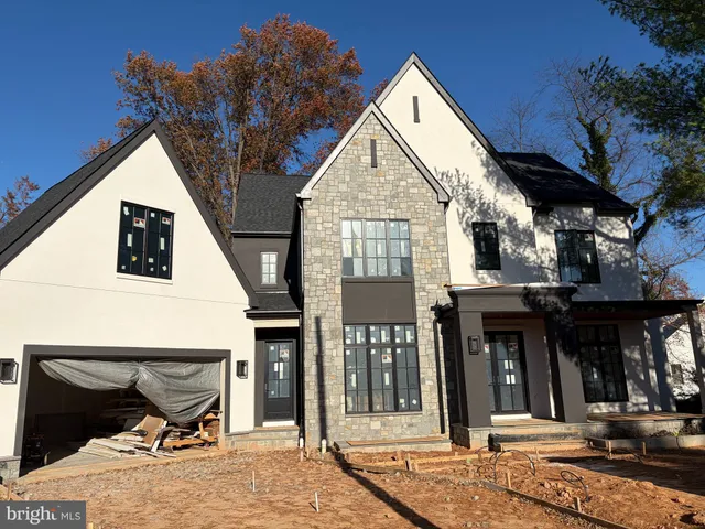 a view of a house with glass windows and a table