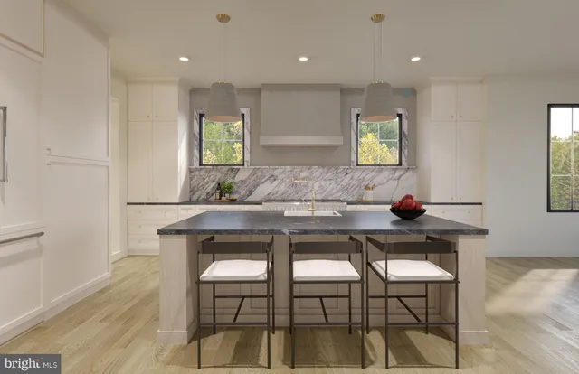 a kitchen with a table and chairs in it