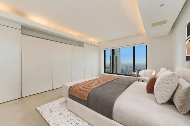 a bedroom with a bed and a dresser