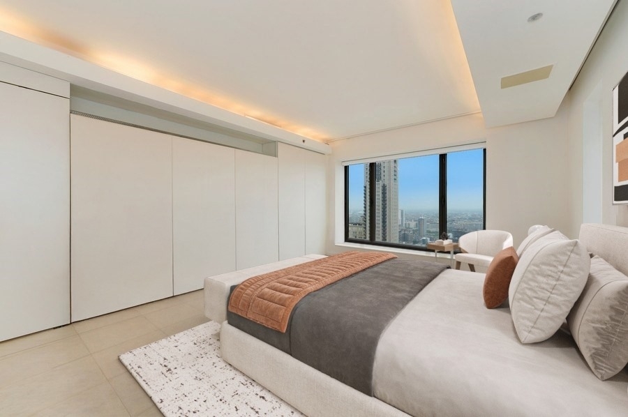 950 North Michigan Avenue, Unit 4003 Chicago, IL 60611 - Photo 8 of 28 a bedroom with a bed and a dresser