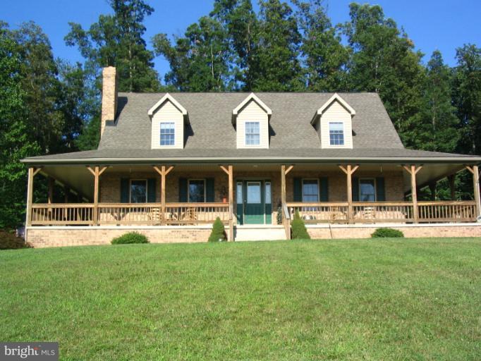 4441 Locust Grove Road Rohrersville, MD 21779 - Photo 22 of 23 a view of a house with sitting area and garden