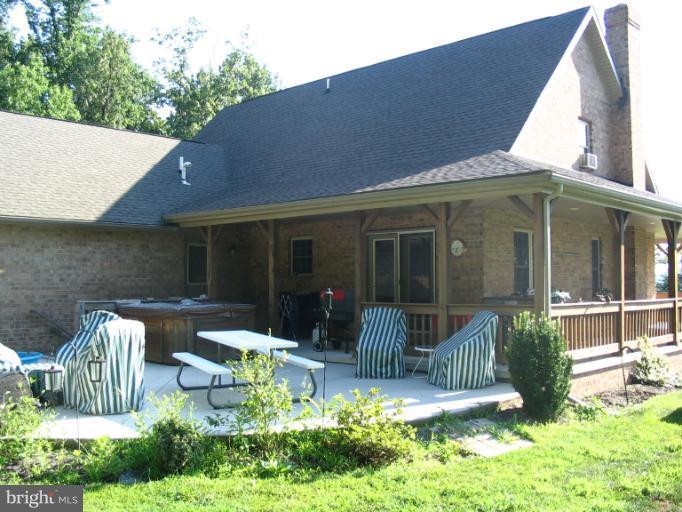 4441 Locust Grove Road Rohrersville, MD 21779 - Photo 9 of 23 a front view of a house with garden