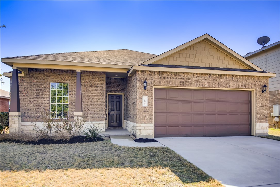 165 Mallard Lane Leander, TX 78641 - Photo 1 of 1 a front view of a house with a yard and garage
