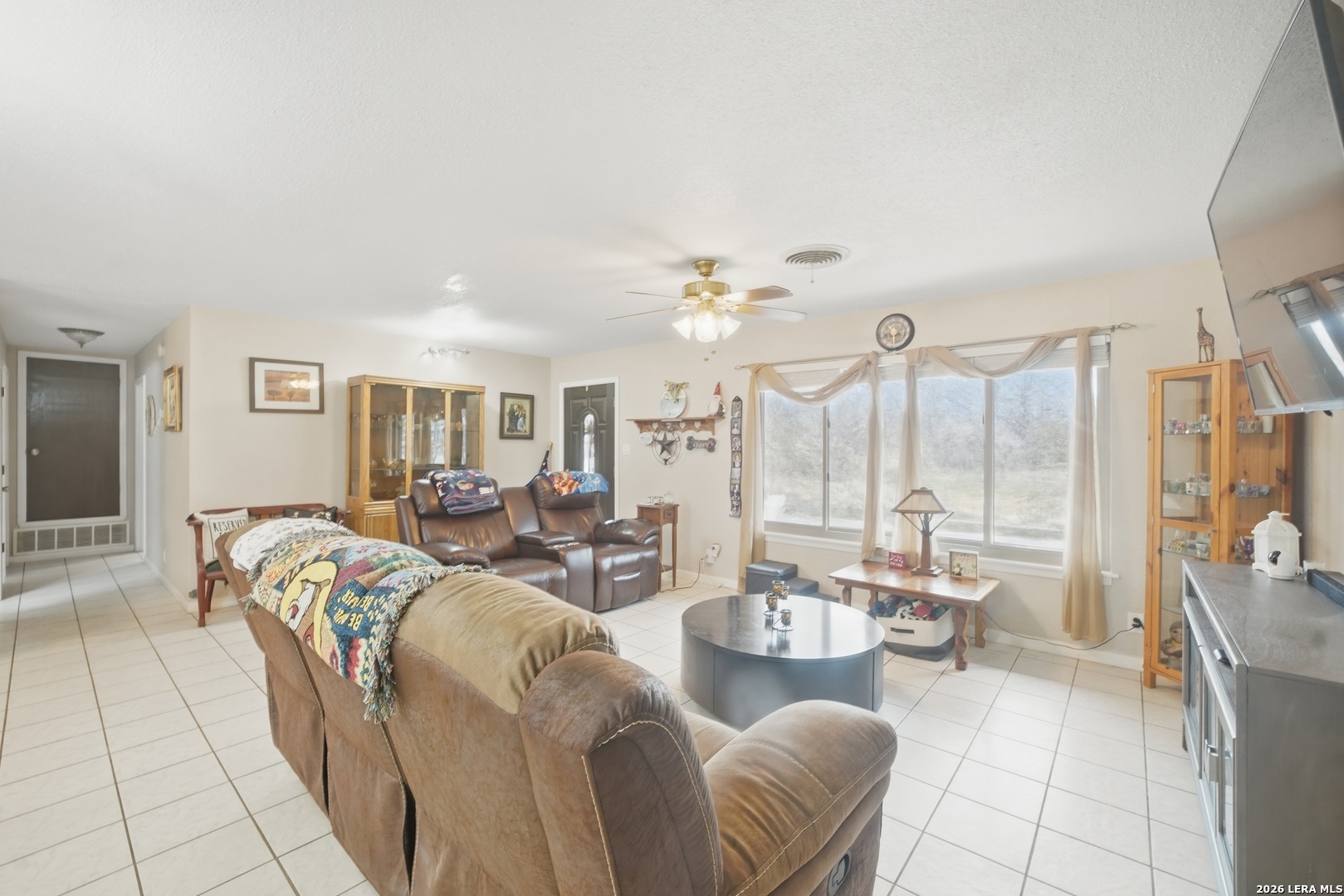 15047 Mesquite Street Lytle, TX 78052 - Photo 13 of 34 a living room with furniture and a large window