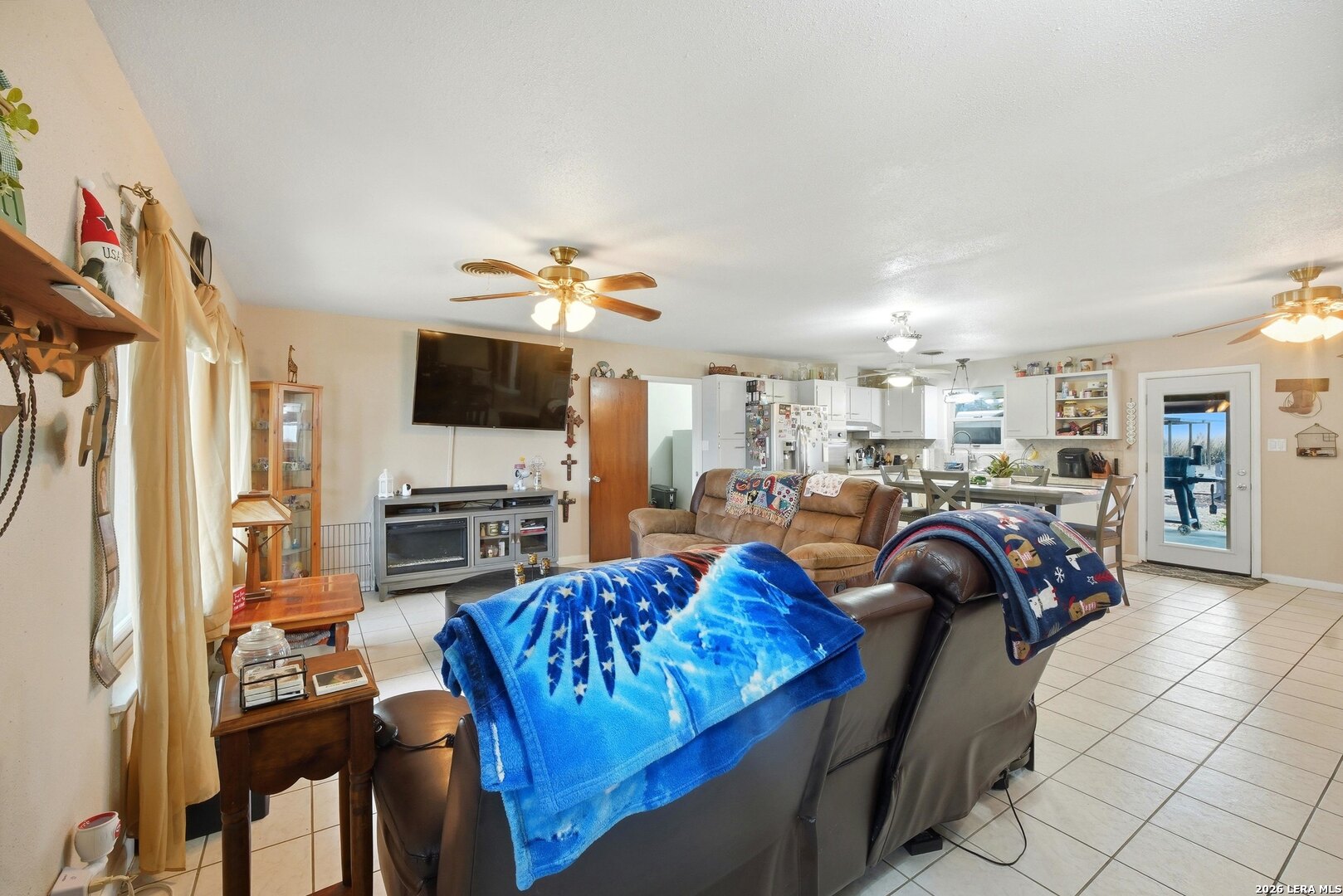 15047 Mesquite Street Lytle, TX 78052 - Photo 14 of 34 a bedroom with furniture and a flat screen tv