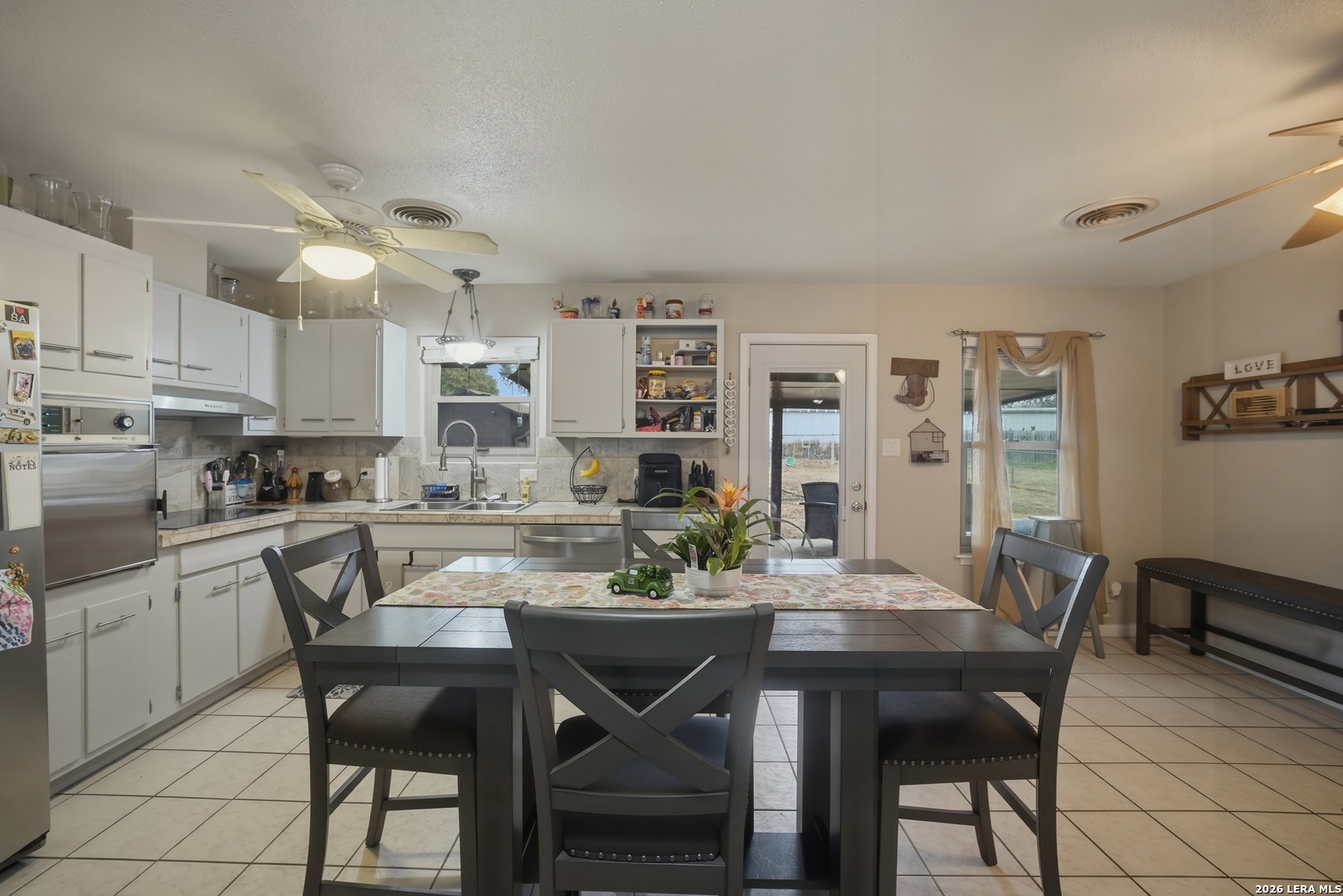 15047 Mesquite Street Lytle, TX 78052 - Photo 20 of 34 a view of a dining room with furniture