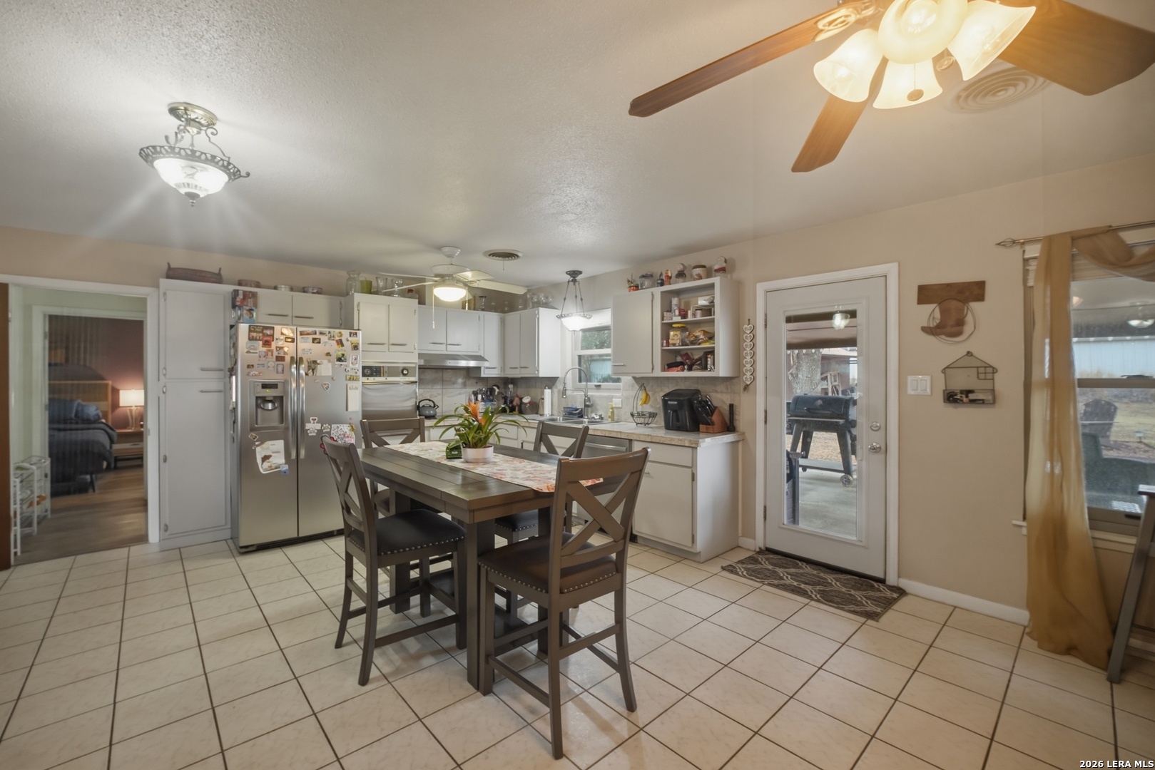 15047 Mesquite Street Lytle, TX 78052 - Photo 21 of 34 a view of a dining room kitchen and a window