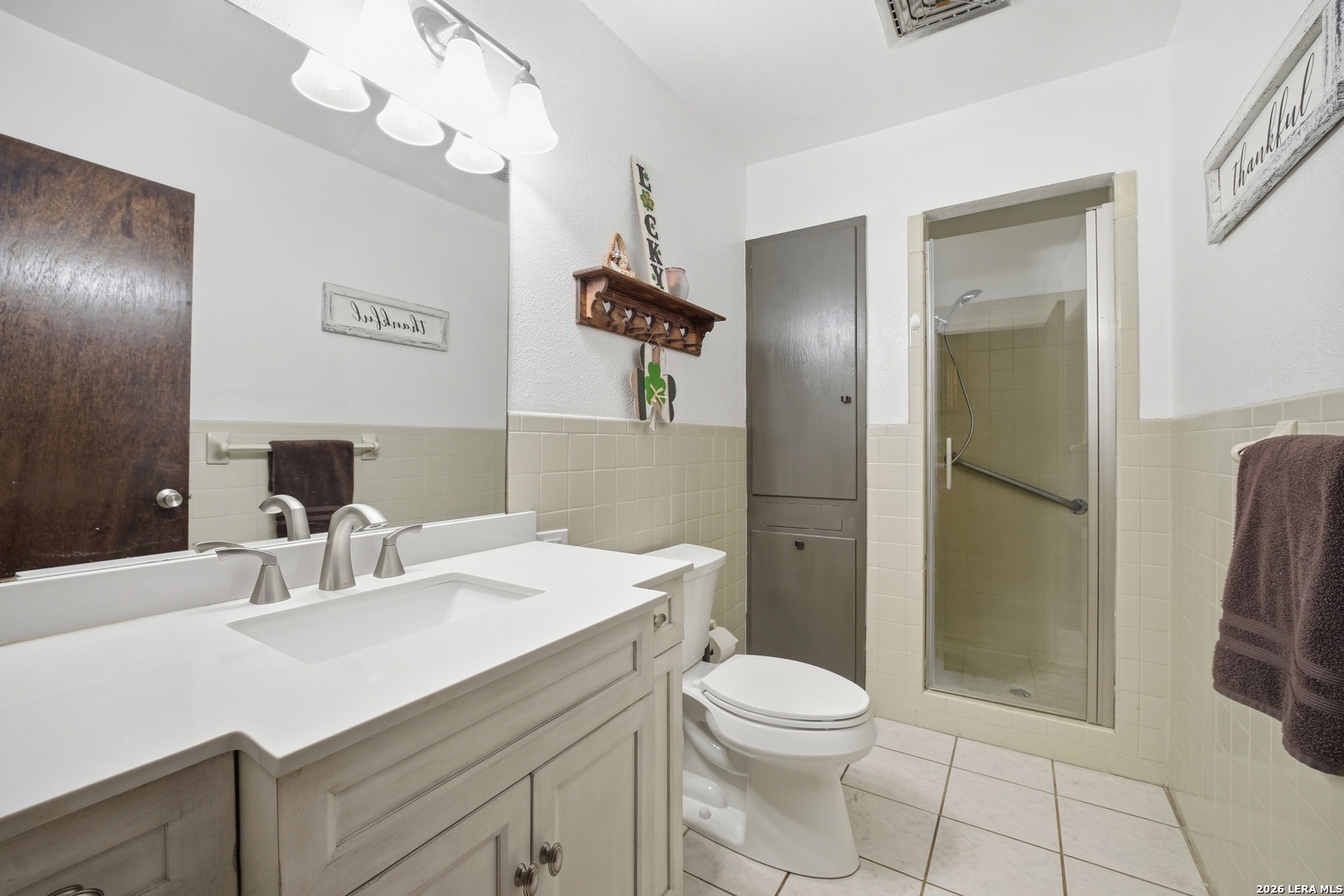 15047 Mesquite Street Lytle, TX 78052 - Photo 25 of 34 a bathroom with a sink a toilet and shower