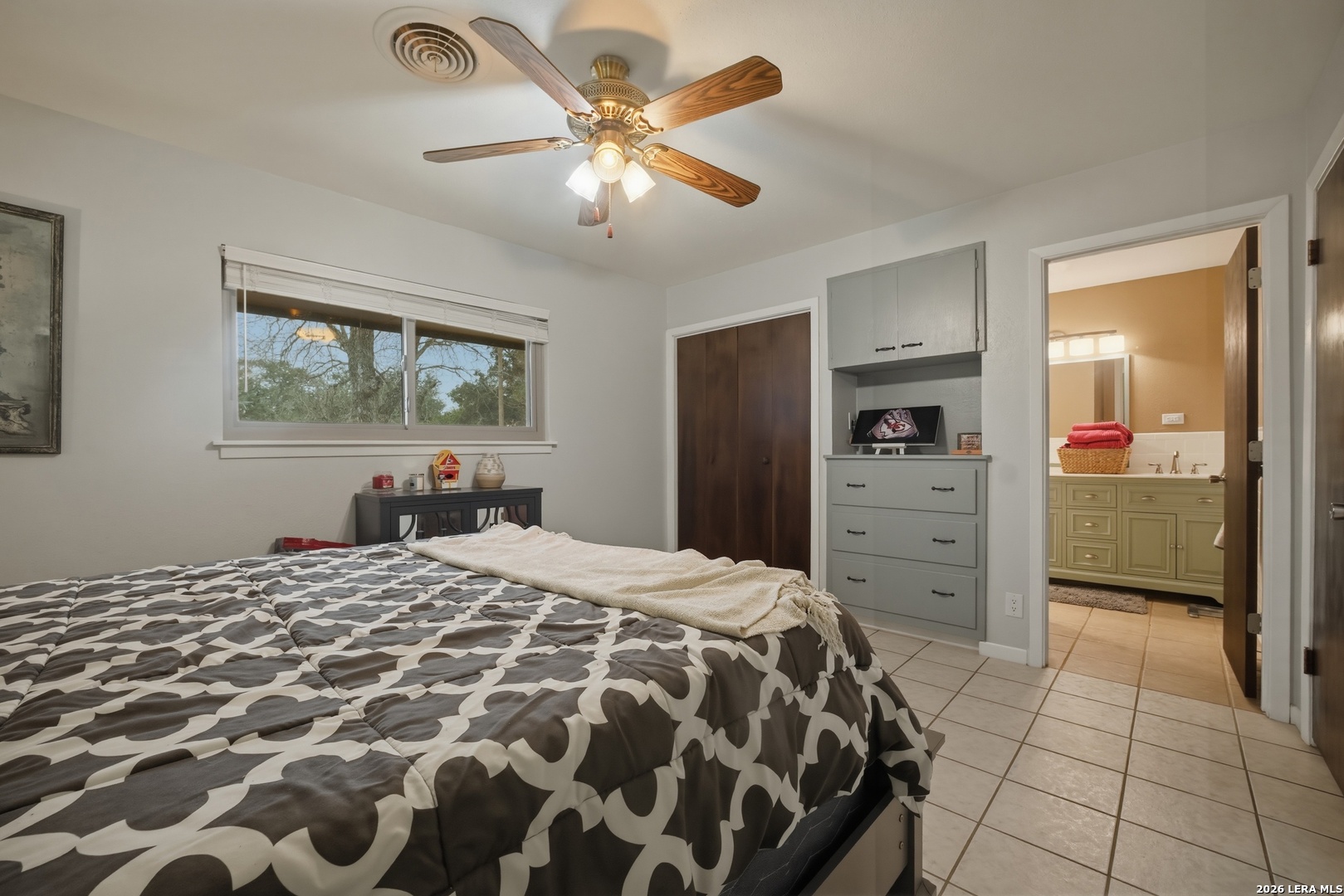 15047 Mesquite Street Lytle, TX 78052 - Photo 27 of 34 a bedroom with a bed and a dresser