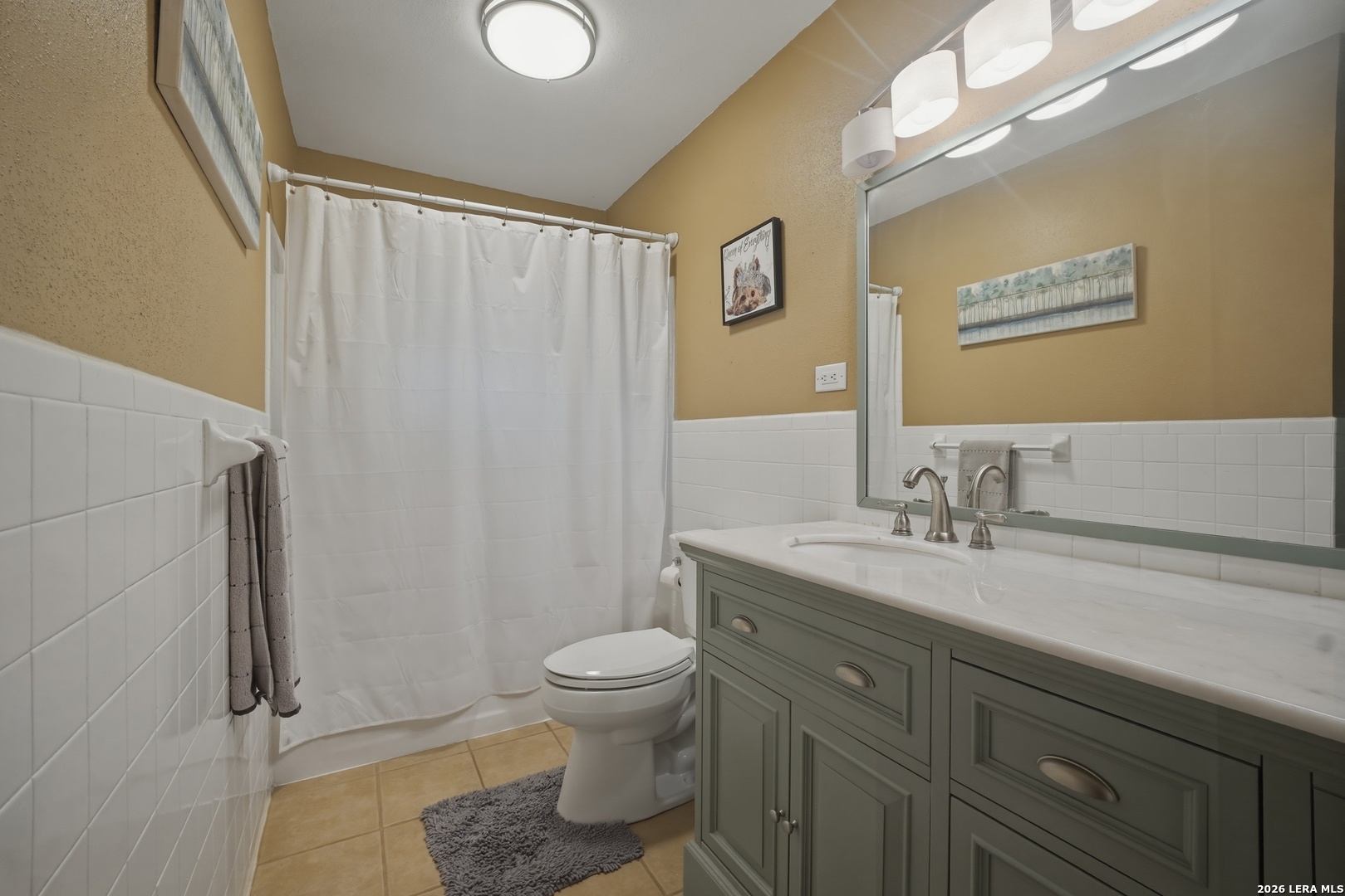 15047 Mesquite Street Lytle, TX 78052 - Photo 28 of 34 a bathroom with a granite countertop sink toilet and shower