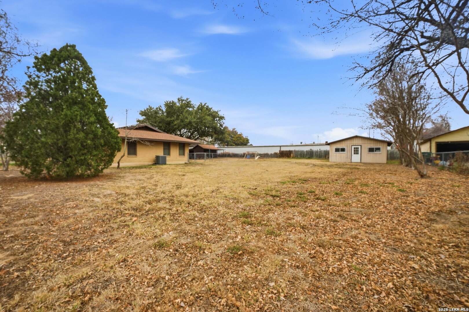 15047 Mesquite Street Lytle, TX 78052 - Photo 34 of 34 a front view of a house with a yard