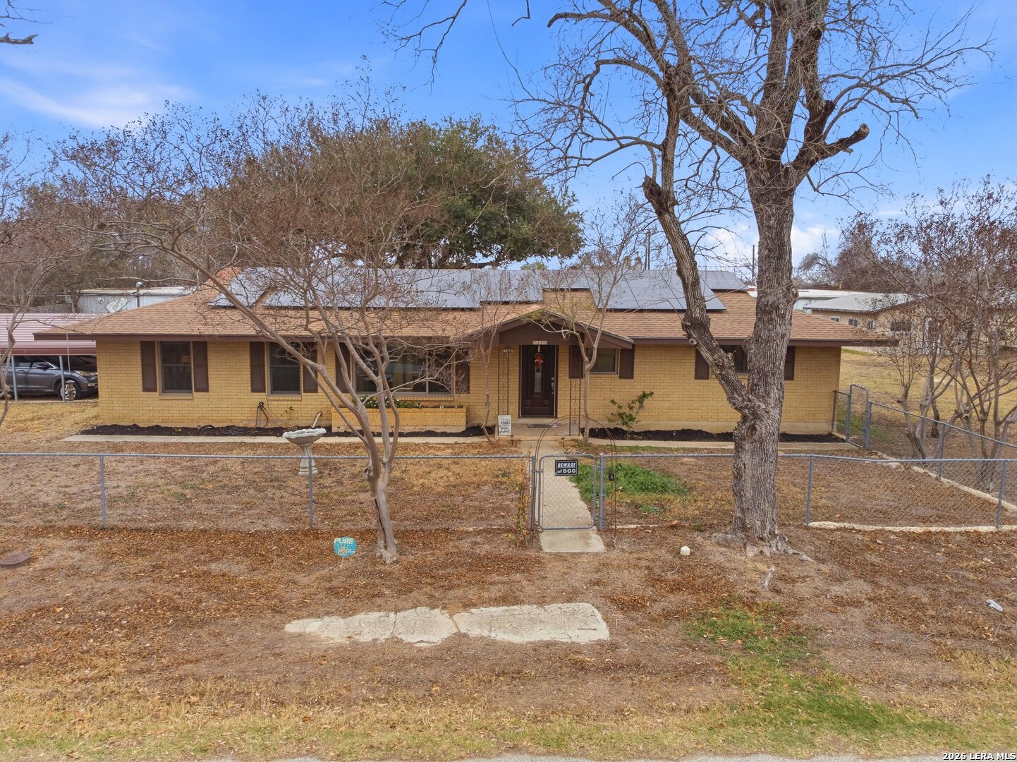 15047 Mesquite Street Lytle, TX 78052 - Photo 6 of 34 a view of a house with a yard