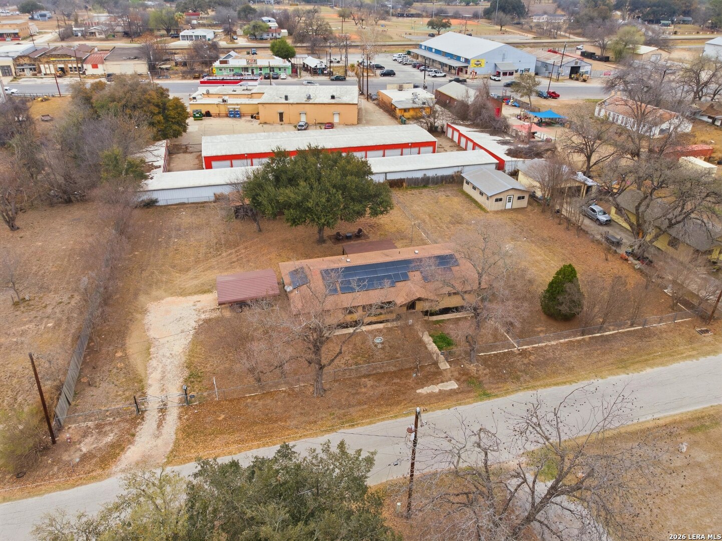 15047 Mesquite Street Lytle, TX 78052 - Photo 9 of 34 an aerial view of residential houses with outdoor space