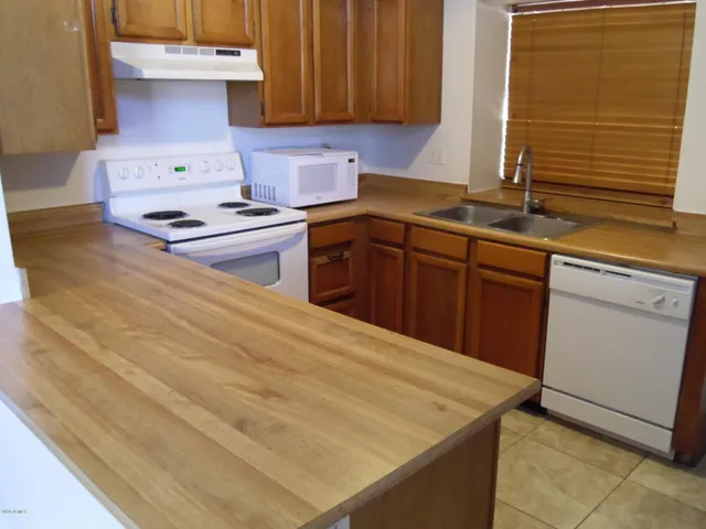 a kitchen with a stove and a sink