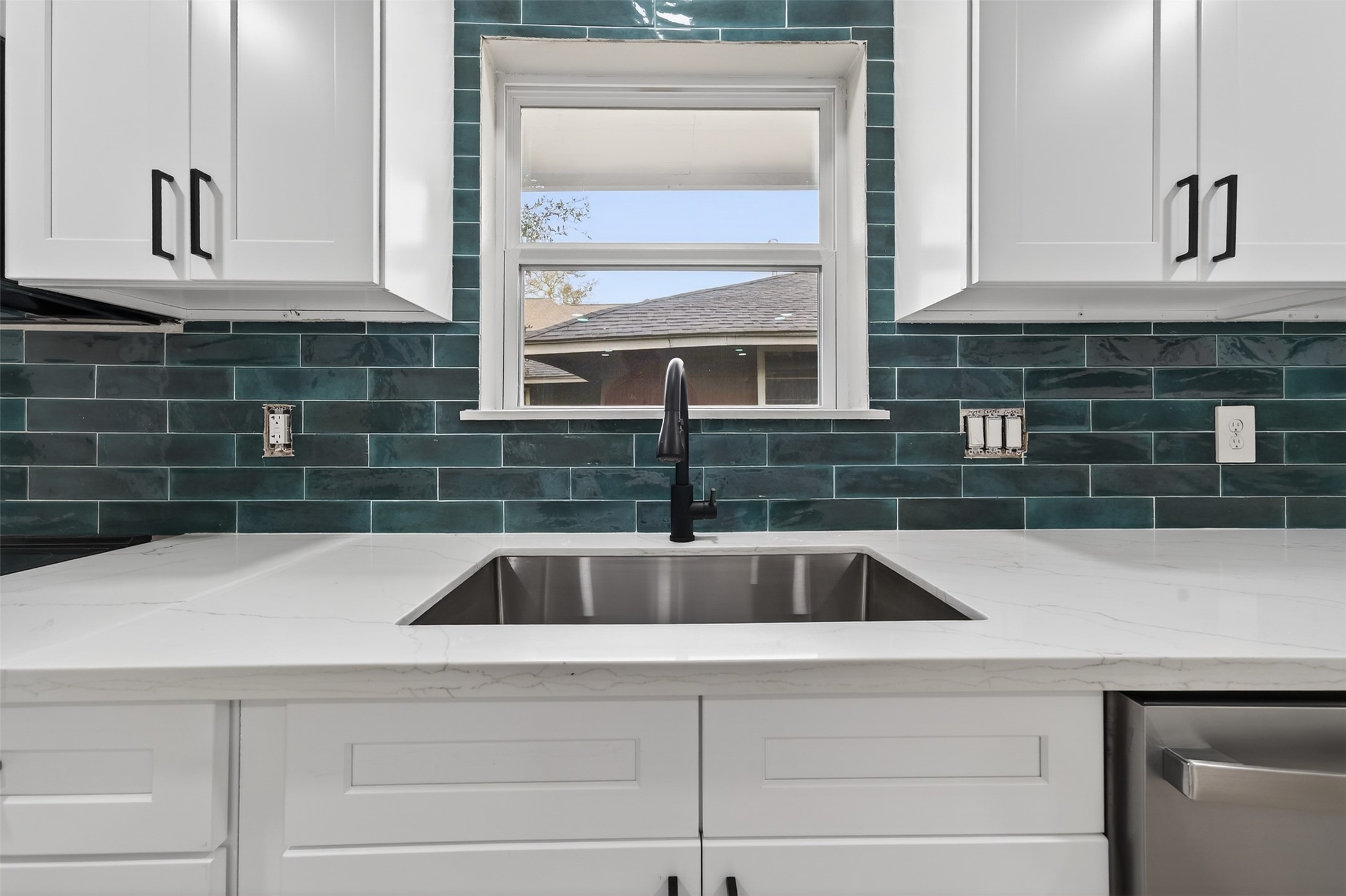6026 Ridgeway Drive Houston, TX 77033 - Photo 12 of 27 a kitchen with a sink and a window