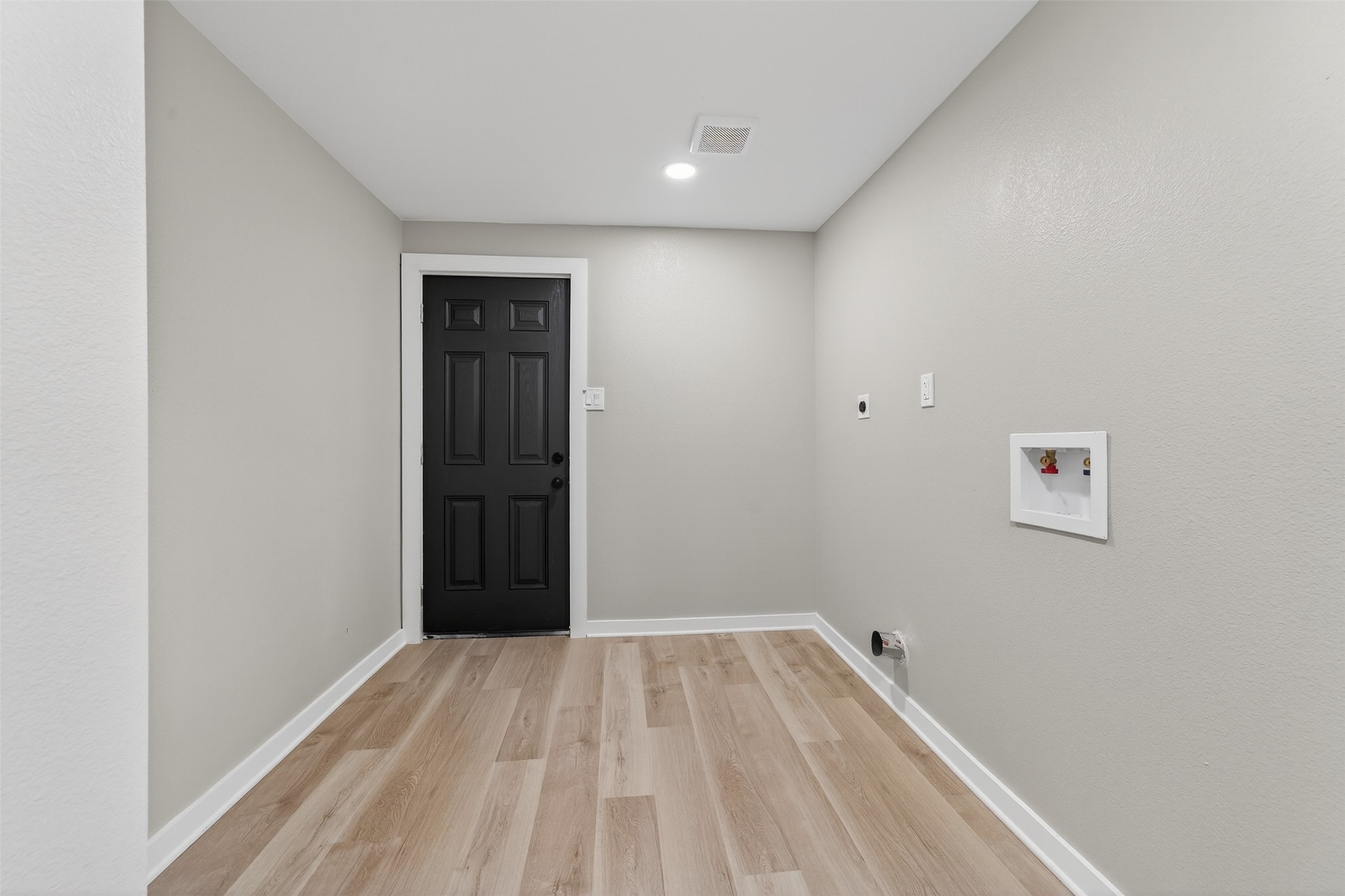 6026 Ridgeway Drive Houston, TX 77033 - Photo 13 of 27 a view of a room with a wooden floor