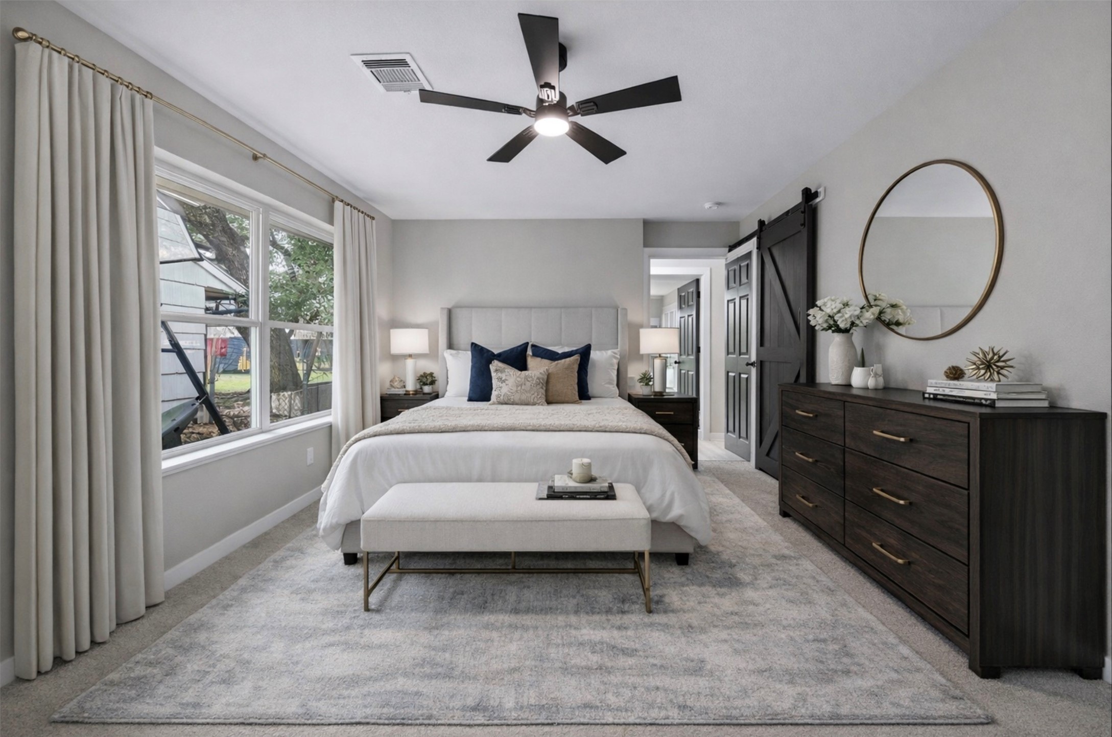 6026 Ridgeway Drive Houston, TX 77033 - Photo 2 of 27 a bedroom with a bed and a mirror