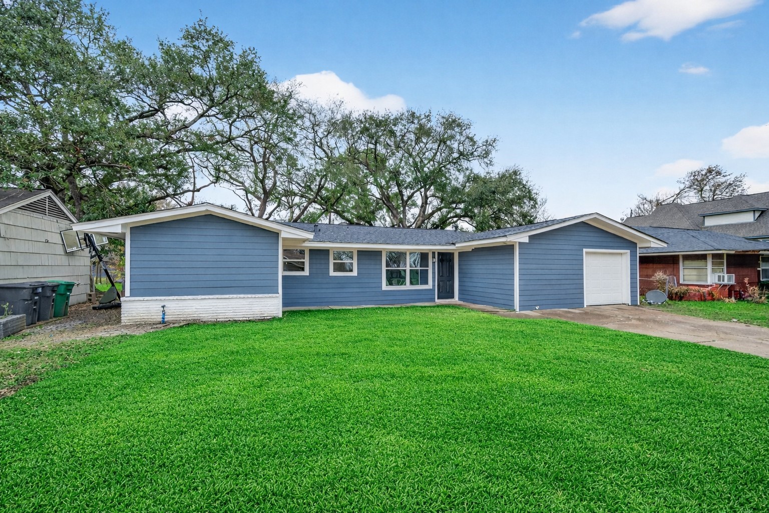 6026 Ridgeway Drive Houston, TX 77033 - Photo 27 of 27 a view of a yard in front of a house with large trees