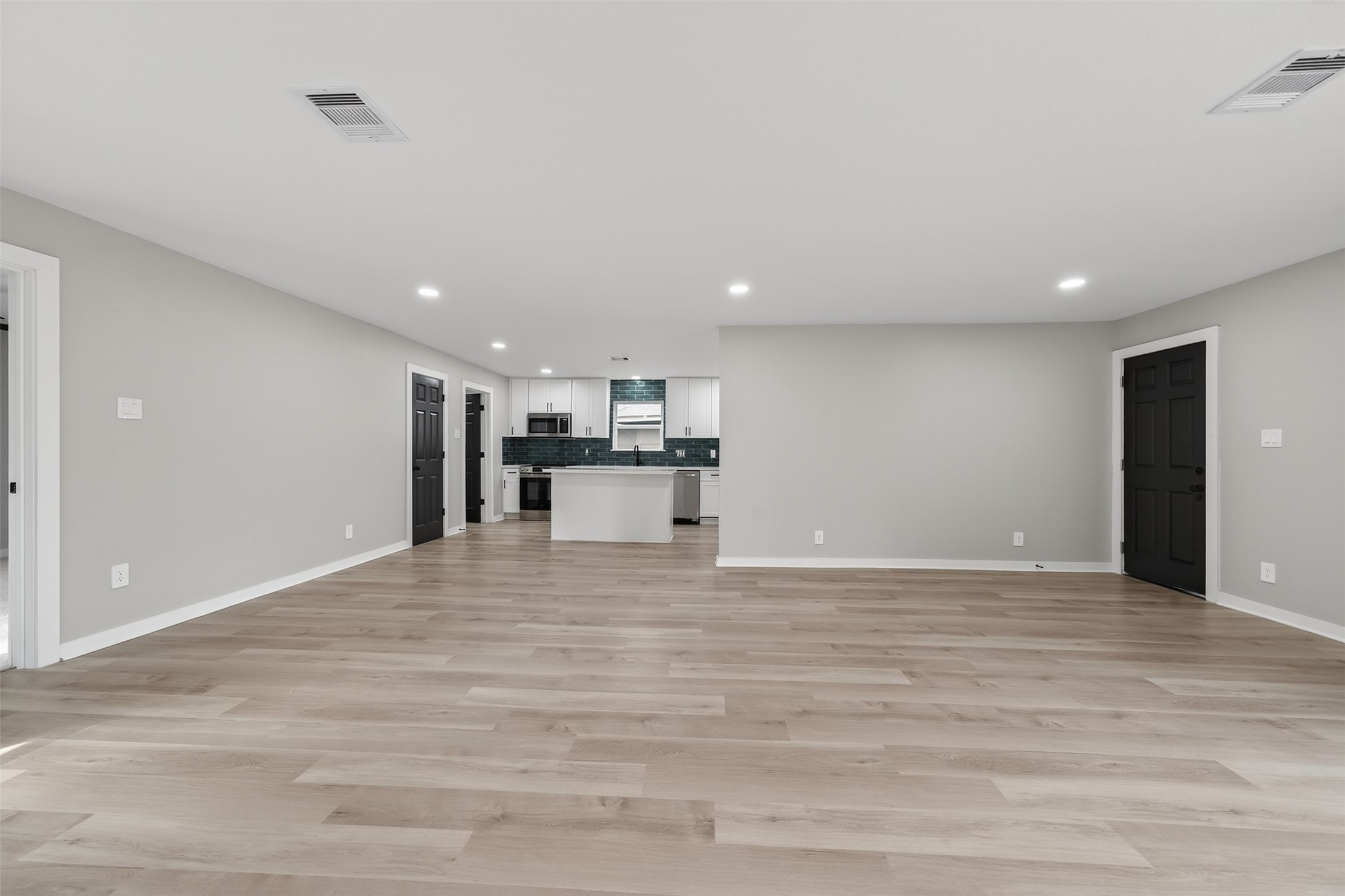 6026 Ridgeway Drive Houston, TX 77033 - Photo 8 of 27 a view of kitchen with kitchen island sink and refrigerator