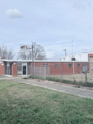 a front view of house with yard and trees