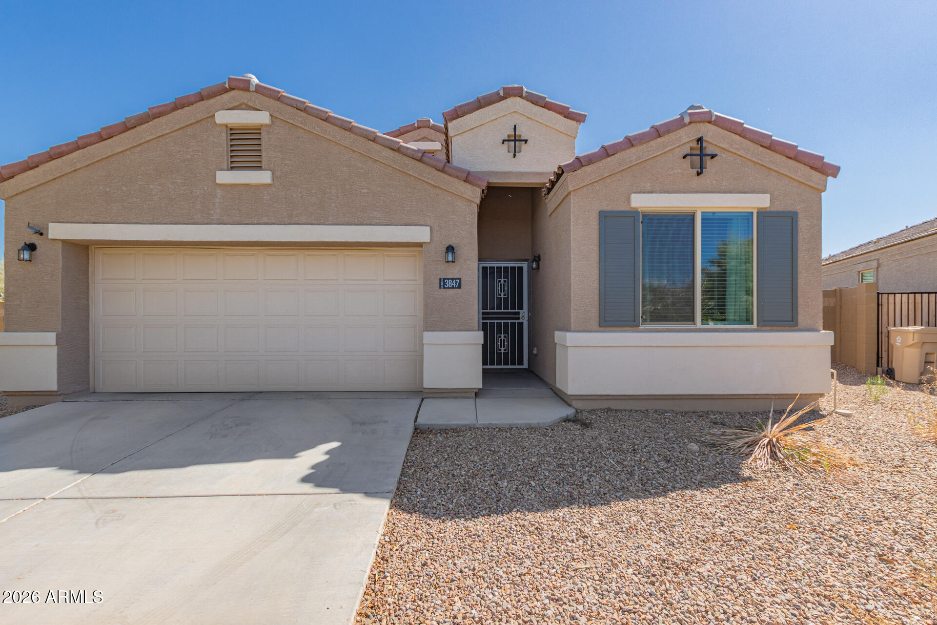 3847 North 308th Lane Buckeye, AZ 85396 - Photo 1 of 32 a front view of a house with a yard and garage