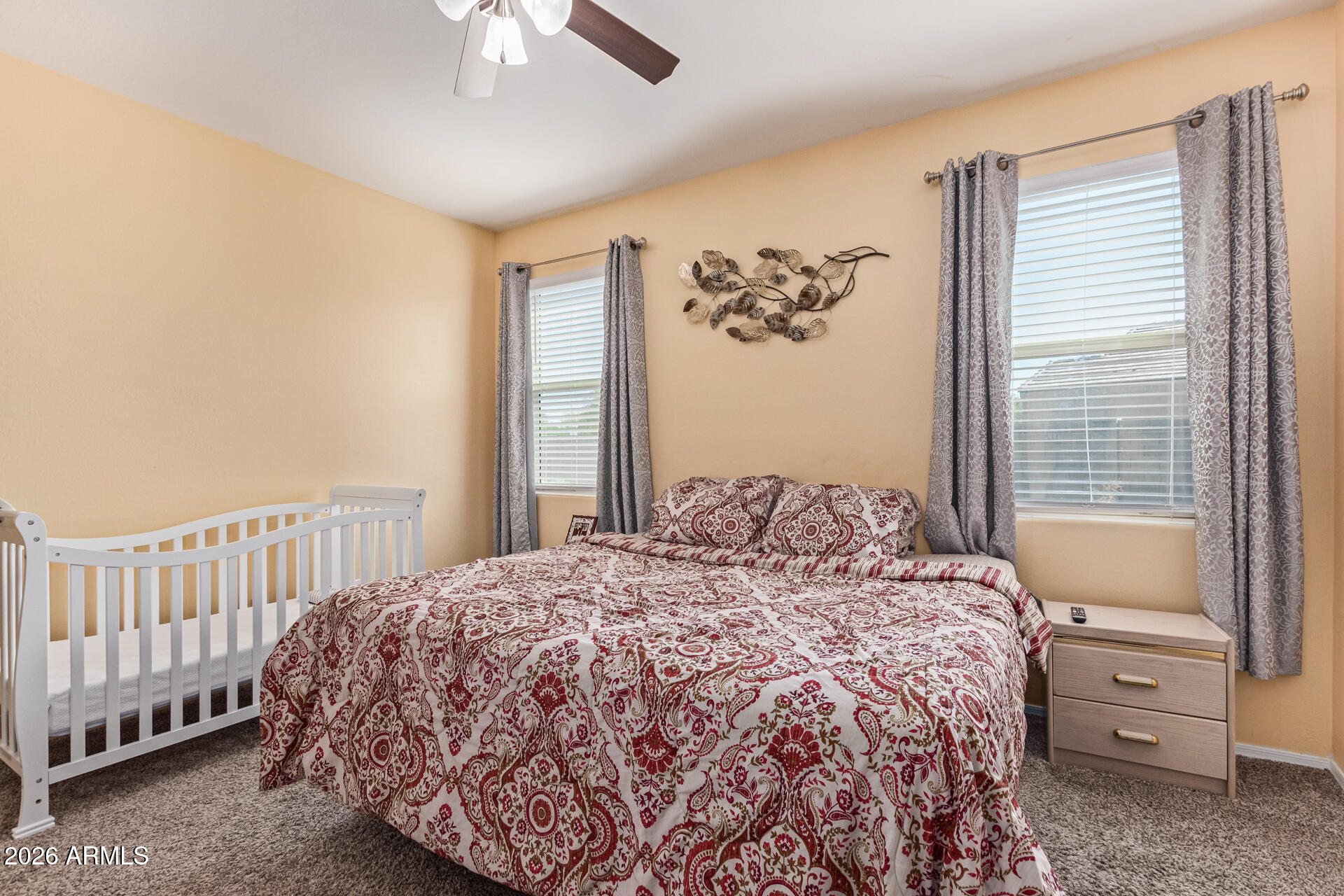 3847 North 308th Lane Buckeye, AZ 85396 - Photo 17 of 32 a bedroom with a bed and a window