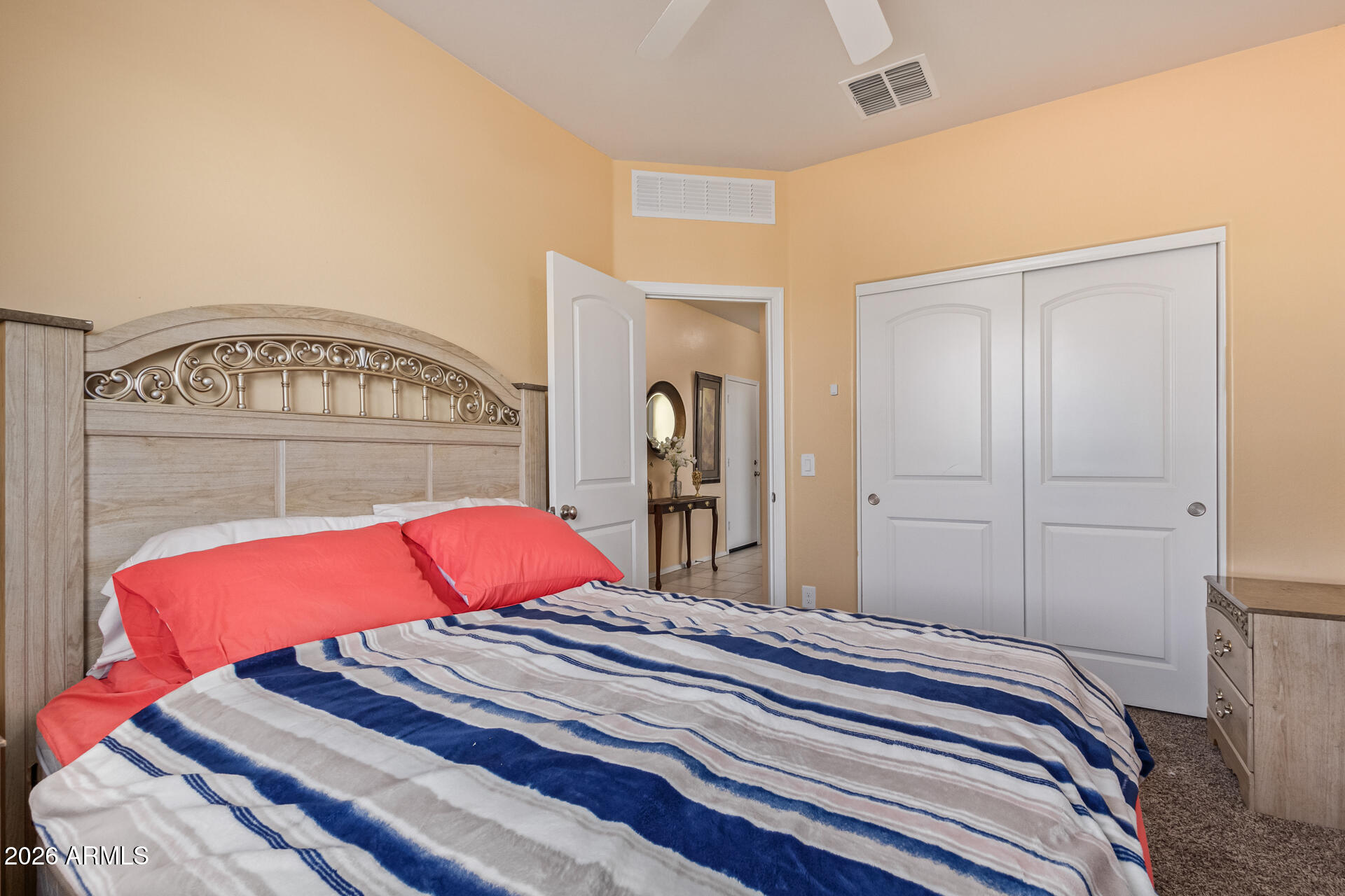 3847 North 308th Lane Buckeye, AZ 85396 - Photo 22 of 32 a bedroom with a bed and a mirror