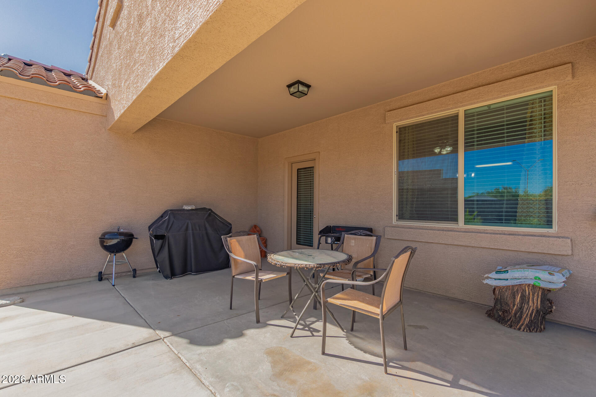 3847 North 308th Lane Buckeye, AZ 85396 - Photo 28 of 32 a couple of chairs sitting in front of a door