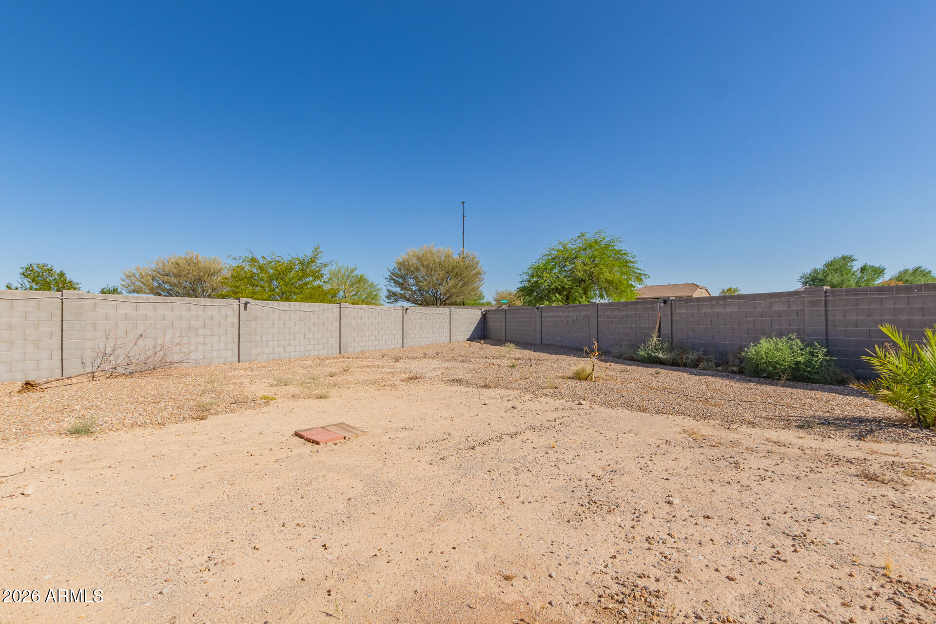 3847 North 308th Lane Buckeye, AZ 85396 - Photo 30 of 32 a backyard of a house
