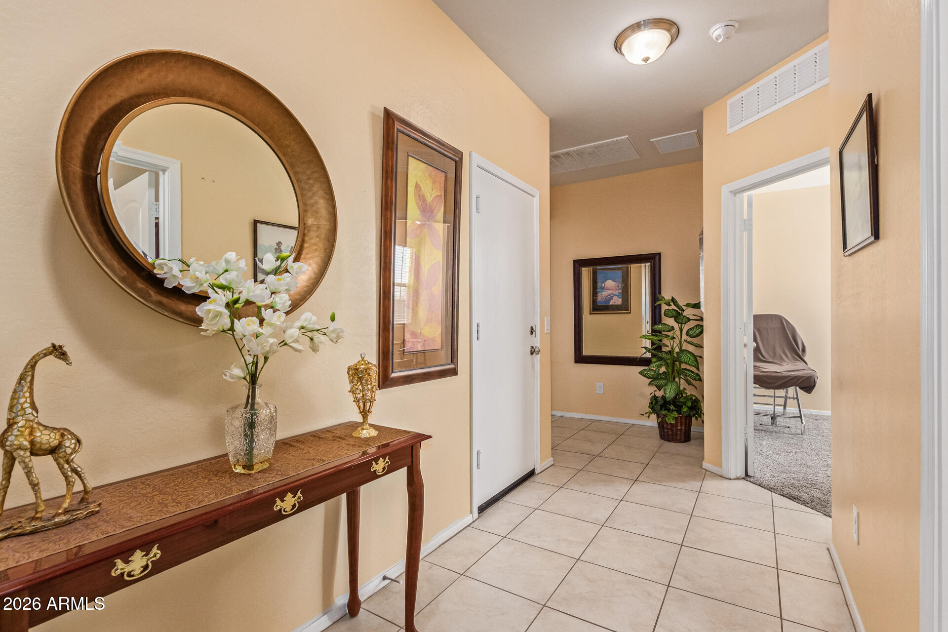 3847 North 308th Lane Buckeye, AZ 85396 - Photo 5 of 32 a view of a bathroom with a sink and a mirror