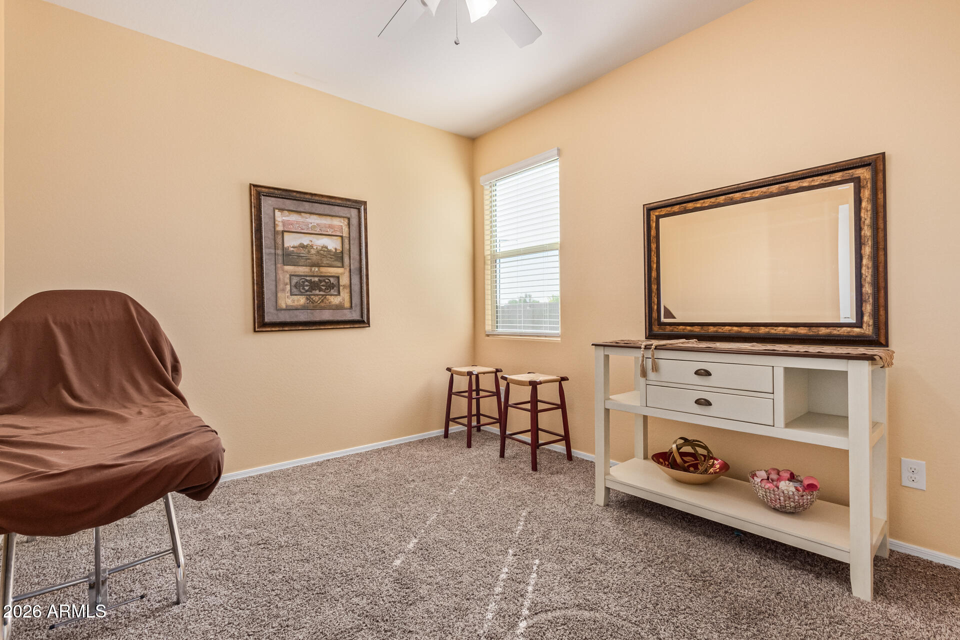 3847 North 308th Lane Buckeye, AZ 85396 - Photo 6 of 32 a living room with furniture and a flat screen tv