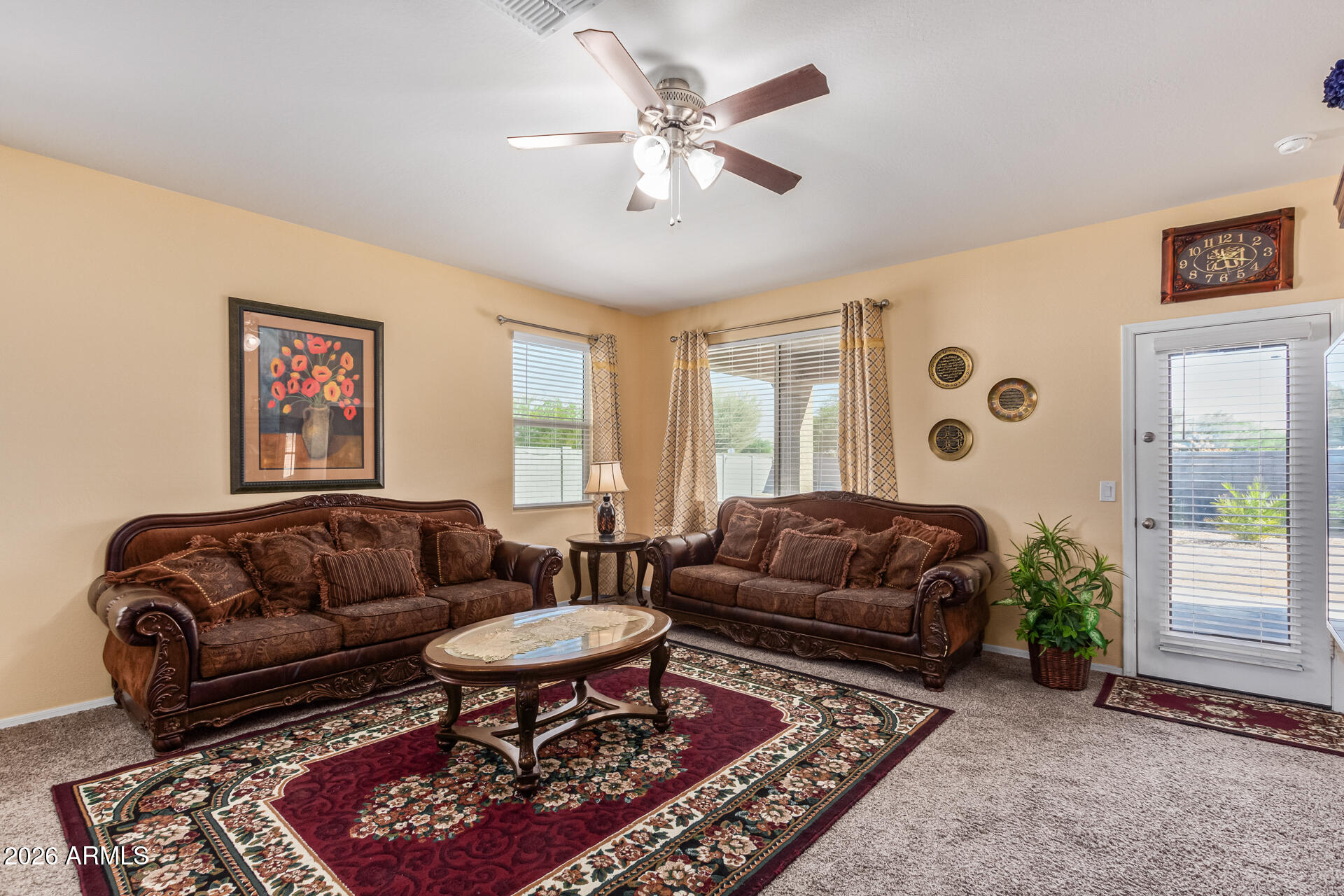 3847 North 308th Lane Buckeye, AZ 85396 - Photo 9 of 32 a living room with furniture and a rug