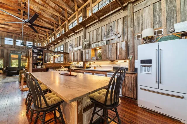 a kitchen with stainless steel appliances granite countertop a stove and a microwave