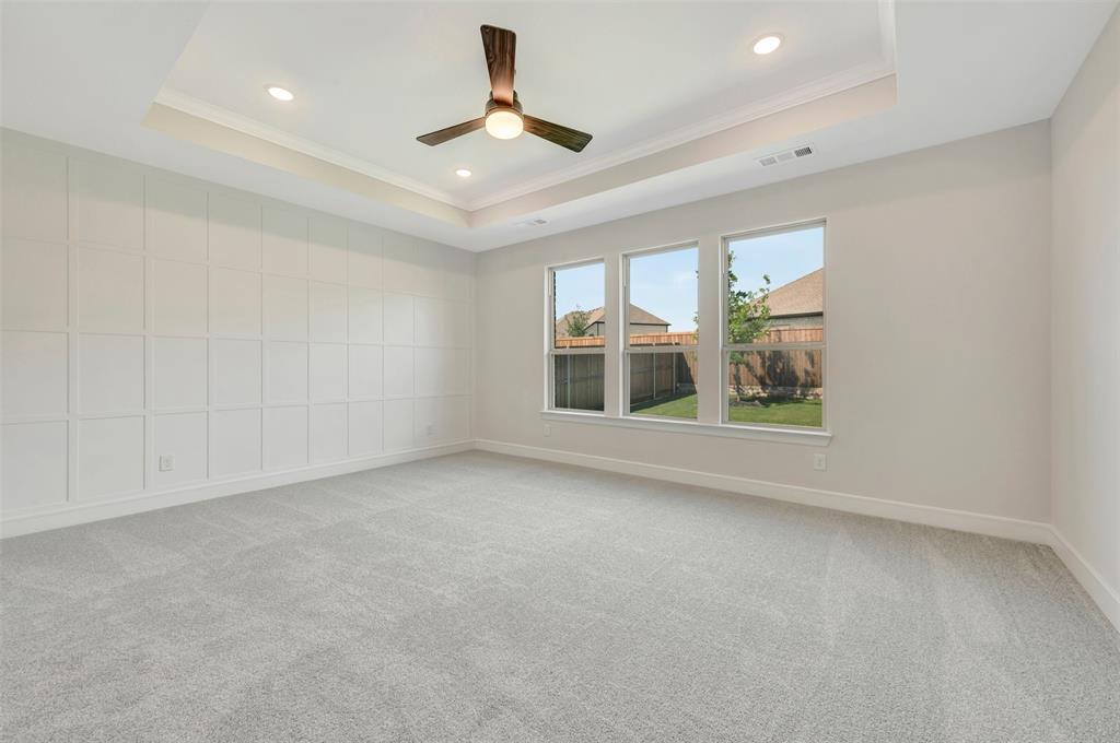 11460 Wulstone Road Fort Worth, TX 76052 - Photo 13 of 40 an empty room with windows and ceiling fan