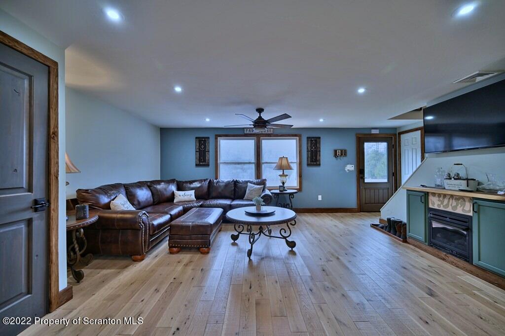 22 Suetta Lane Moscow, PA 18444 - Photo 10 of 53 a living room with furniture and a wooden floor